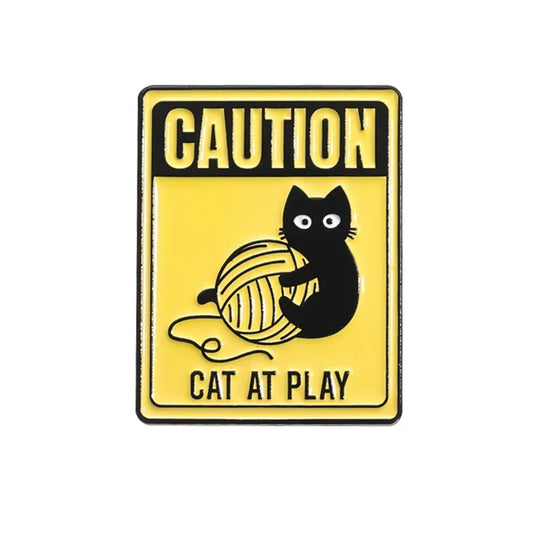 Pin Caution cat at play