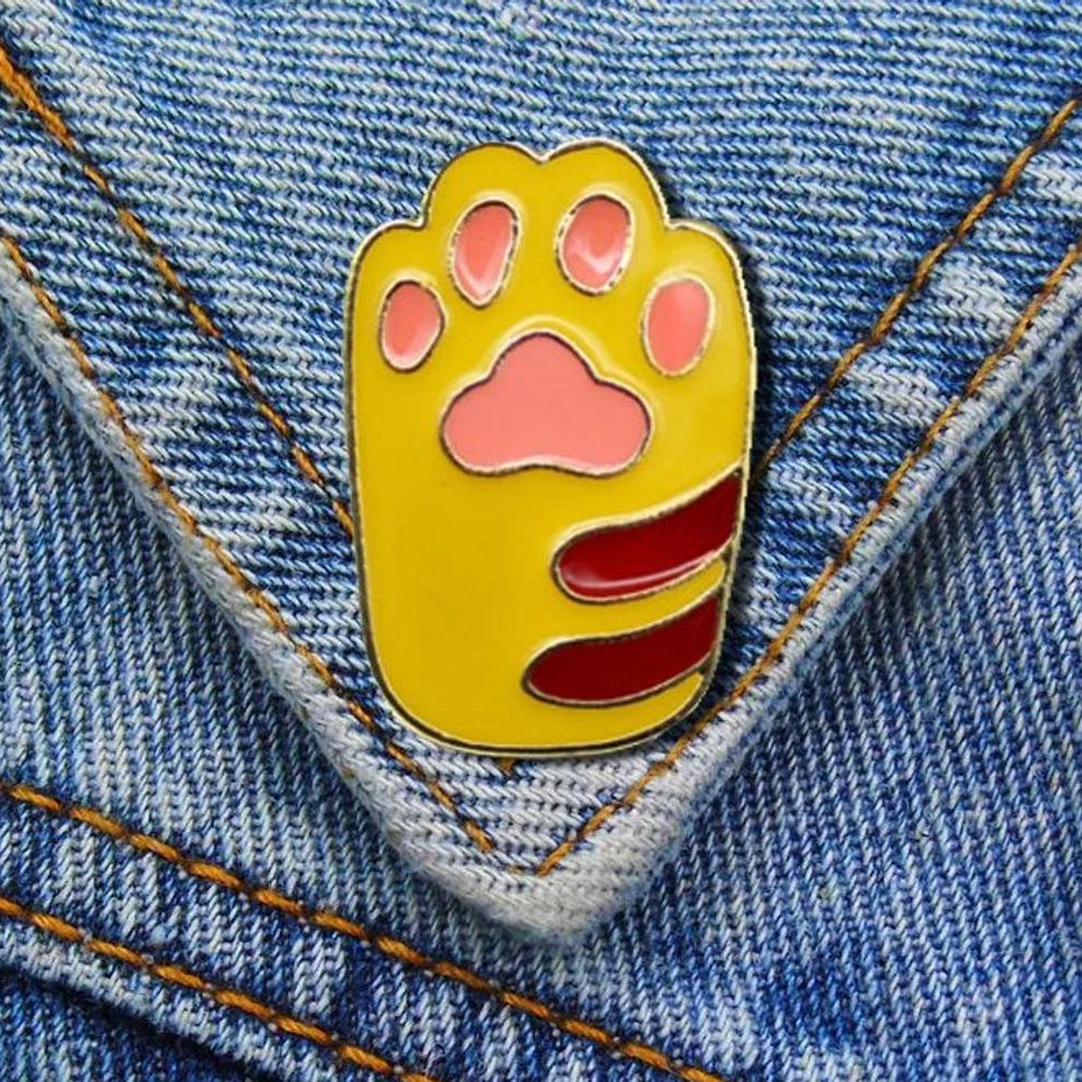 Pin huella gato amarillo